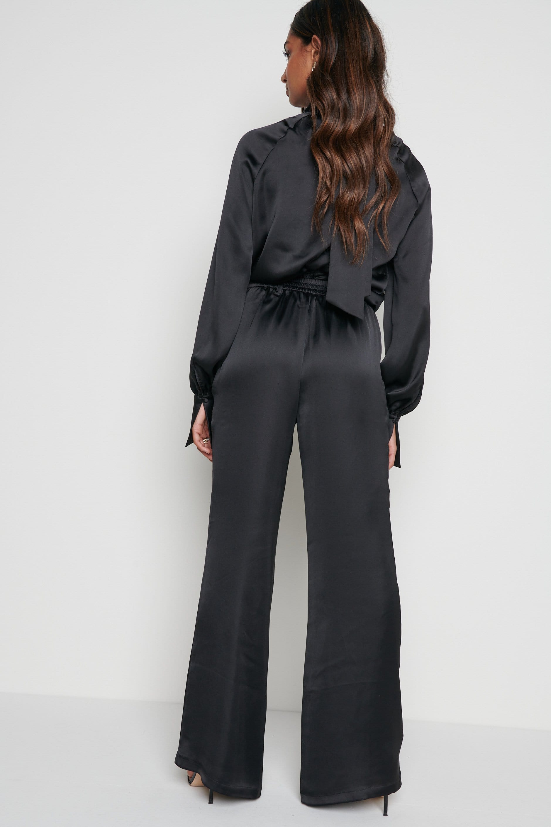 First Distraction the label high waisted satin wide leg trousers in black   ASOS
